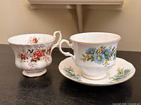 Both teacups and saucer front view