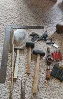 overview of assorted hand tools on carpet