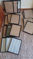 all frames spread on carpet showing quantity and finishes