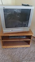 Front view showing Panasonic CRT TV on oak stand with VCR beneath