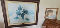 Overall view of both framed prints on wall and furniture