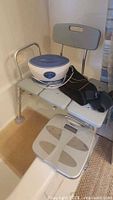 Overall view showing transfer bench, foot spa, massage belt and digital scale