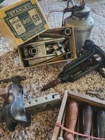 Overview showing Stanley J16 box, oil can, plane bodies, jig block and chisels