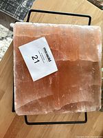 Top view of Himalayan pink salt block on metal stand