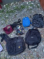 All seven bags laid out on gravel