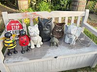 Group shot of all garden décor items on bench