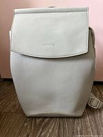 Front view of light gray Pixie Mood backpack