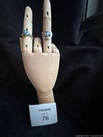 Both sterling silver rings on mannequin hand