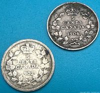 Both coins obverse shown, dates 1902 and 1906 visible