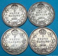 Reverse of all four coins showing dates and denomination