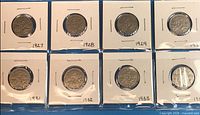 Eight 2x2 flips labeled 1927-1934 showing six circulated Canadian nickels