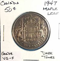 Obverse and reverse of 1947 50-cent Maple Leaf coin in cardboard holder