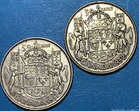 Both 1951 and 1952 Canadian 50-cent coins reverse sides