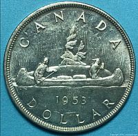Reverse of 1953 Canadian silver dollar showing canoe design and date