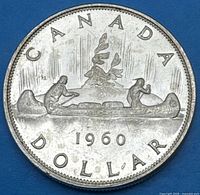 Reverse side showing CANADA DOLLAR 1960 Voyageur design