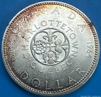 Reverse of 1964 Charlottetown Quebec silver dollar showing floral design and inscriptions