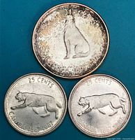 Obverse of three 1967 Canadian Centennial coins showing wildlife designs