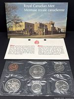 Full set showing envelope, COA and sealed coin strip
