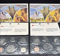 Both 1981 and 1982 coin sets with envelopes and certificates visible