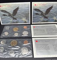 Both proof-like sets with envelopes and COA cards visible