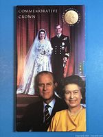 Front of presentation folder showing coin title and royal couple