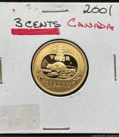 Front of coin in 2x2 flip showing beaver design and denomination