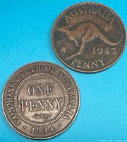 Both 1934 and 1943 Australian one-penny coins front sides