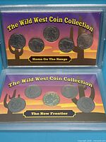 Both Wild West Coin Collection sets in holders