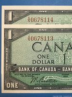 Obverse details showing consecutive serial numbers A0678113 and A0678114