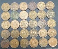 30 Canadian one cent coins laid out reverse side visible