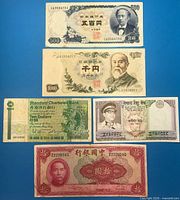 All five banknotes laid out front side visible