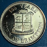 Obverse with coat of arms and 100 YEARS Town of Brampton legend