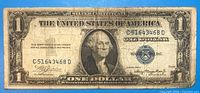 Front of 1935 $1 silver certificate showing portrait, serial C51643468D, blue seal