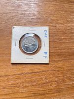 Coin reverse showing caribou design in flip