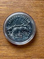 Reverse side of coin showing bear design