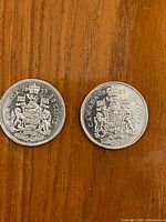 Both 1975 and 1981 Canadian 50-cent coins obverse view