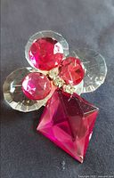 Front view showing pink and clear faceted stones and rhinestone centre