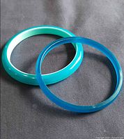 Both bangles side by side showing color and size contrast
