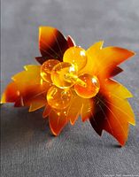Front view showing amber lucite beads and leaf design details