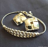 Bracelet and earrings grouped together