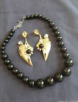 Necklace and earrings laid out together