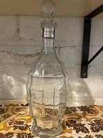 Full view of decanter showing stopper, body shape and lower label