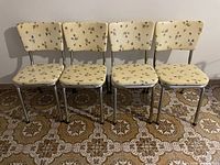 Four matching chrome frame dining chairs, full view