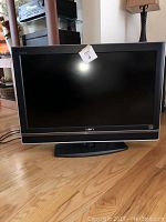 Frontal view of the Sony 32 inch BRAVIA XBR LCD TV showing the full screen and base stand.