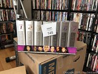 Star Trek The Next Generation Seasons 1 to 7 DVD box set with silver metallic cases and character images.