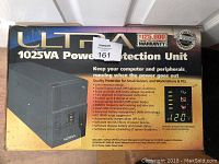 Front view of the original retail box of the Ultra 1025VA power protection unit showing product name, features, and warranty information.