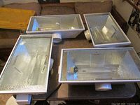 Four Sun System reflector fixtures displayed on table