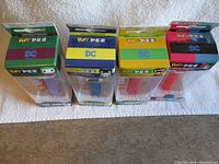 Four boxed Funko Pop PEZ dispensers standing side by side