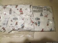 Both sealed packages of Hollister pajama pants showing holiday print fabric