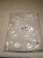 Front view of packaged beige Hollister shorts